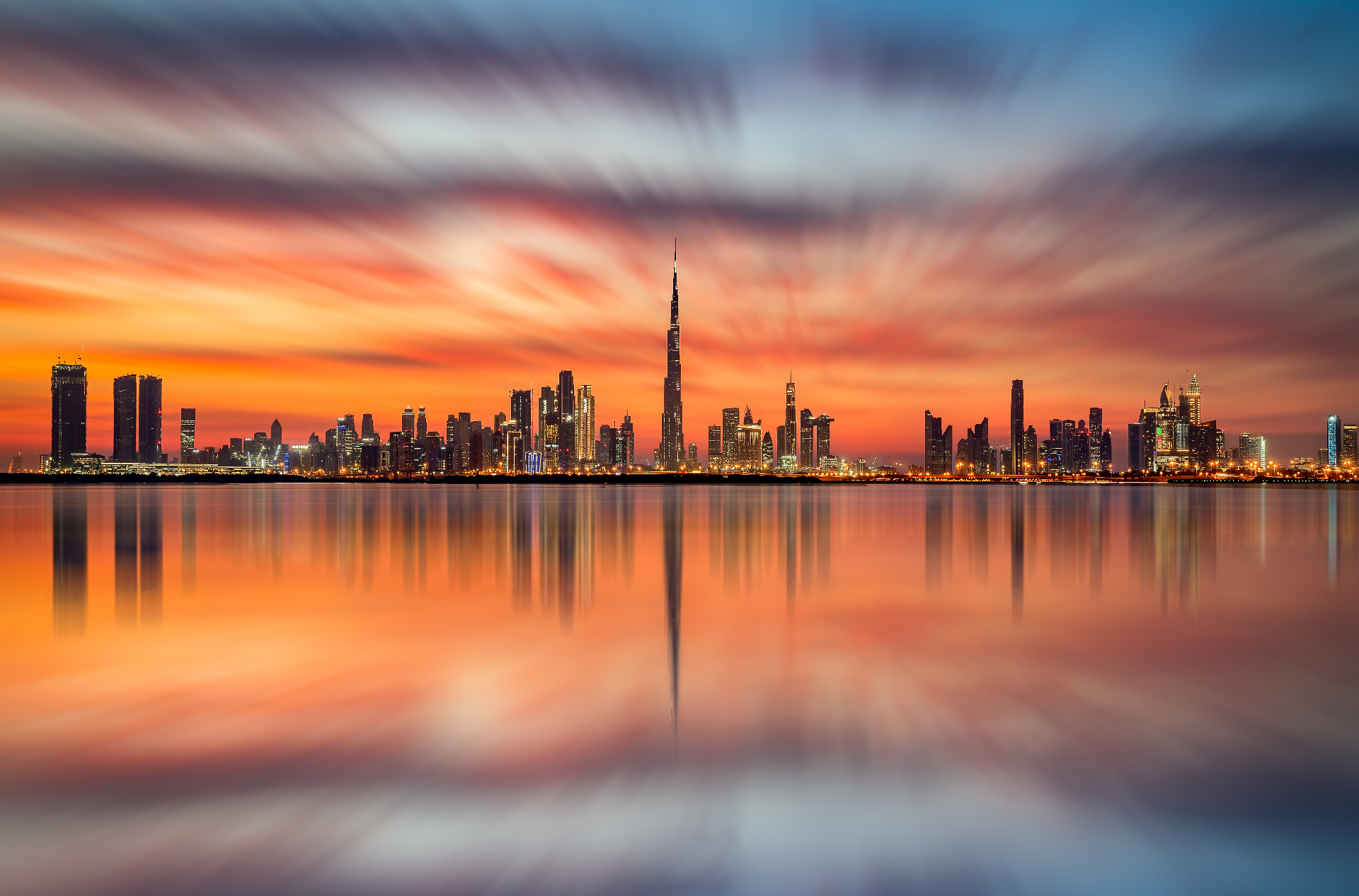 Dubai skyline reflected at sunset